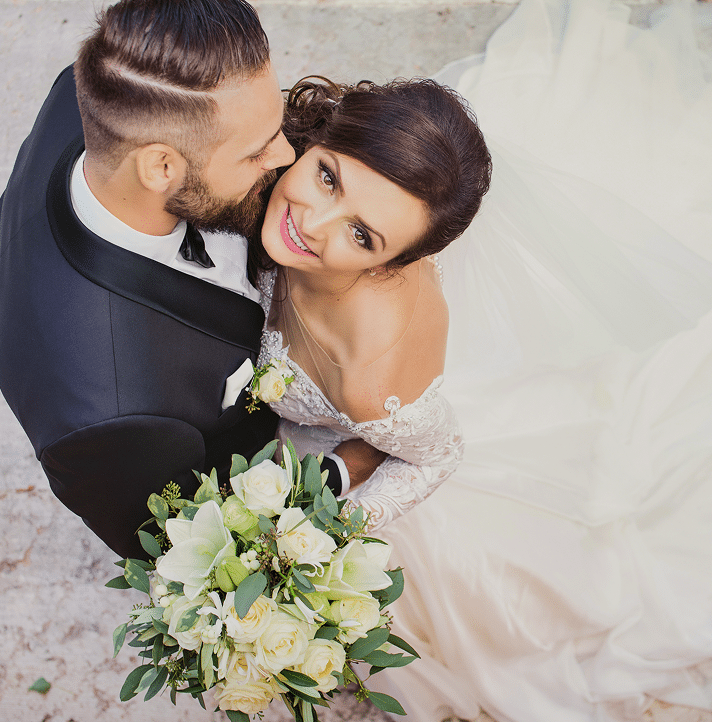 Bride and groom embracing at their wedding celebration